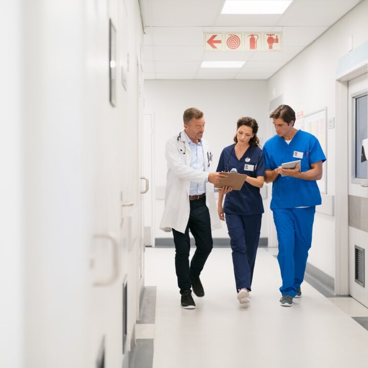 Medical staff discussing report at hospital