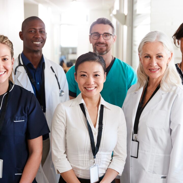 Portrait Of Medical Team Standing In Hospital Corridor